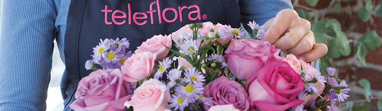 florist working on a flower bouquet from florist marketing. Bouquet from florist website order
